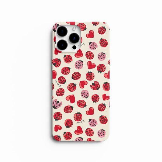 Coque de téléphone motif coccinelles rouges et roses avec cœurs